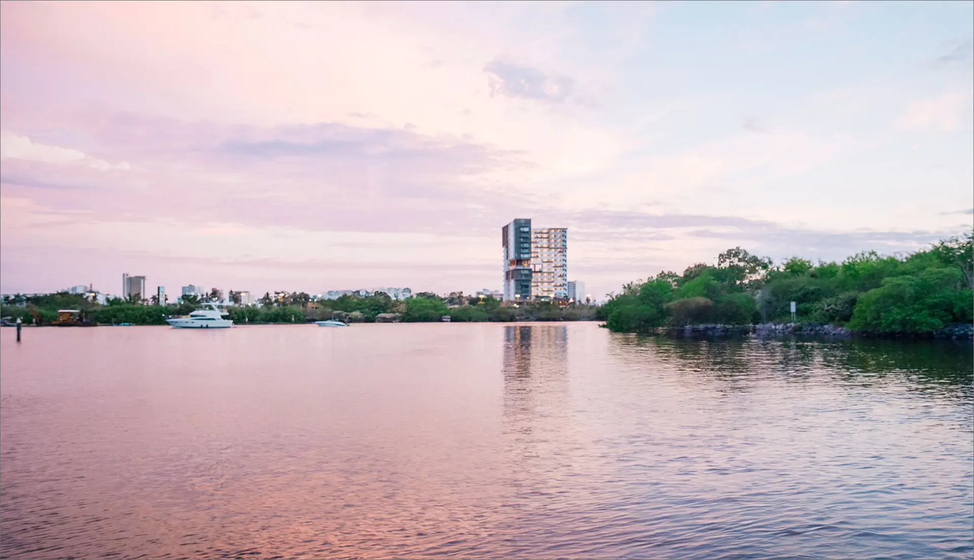 Scenic waterfront in Mazatlán at sunset, showcasing the city's modern lifestyle and natural beauty.