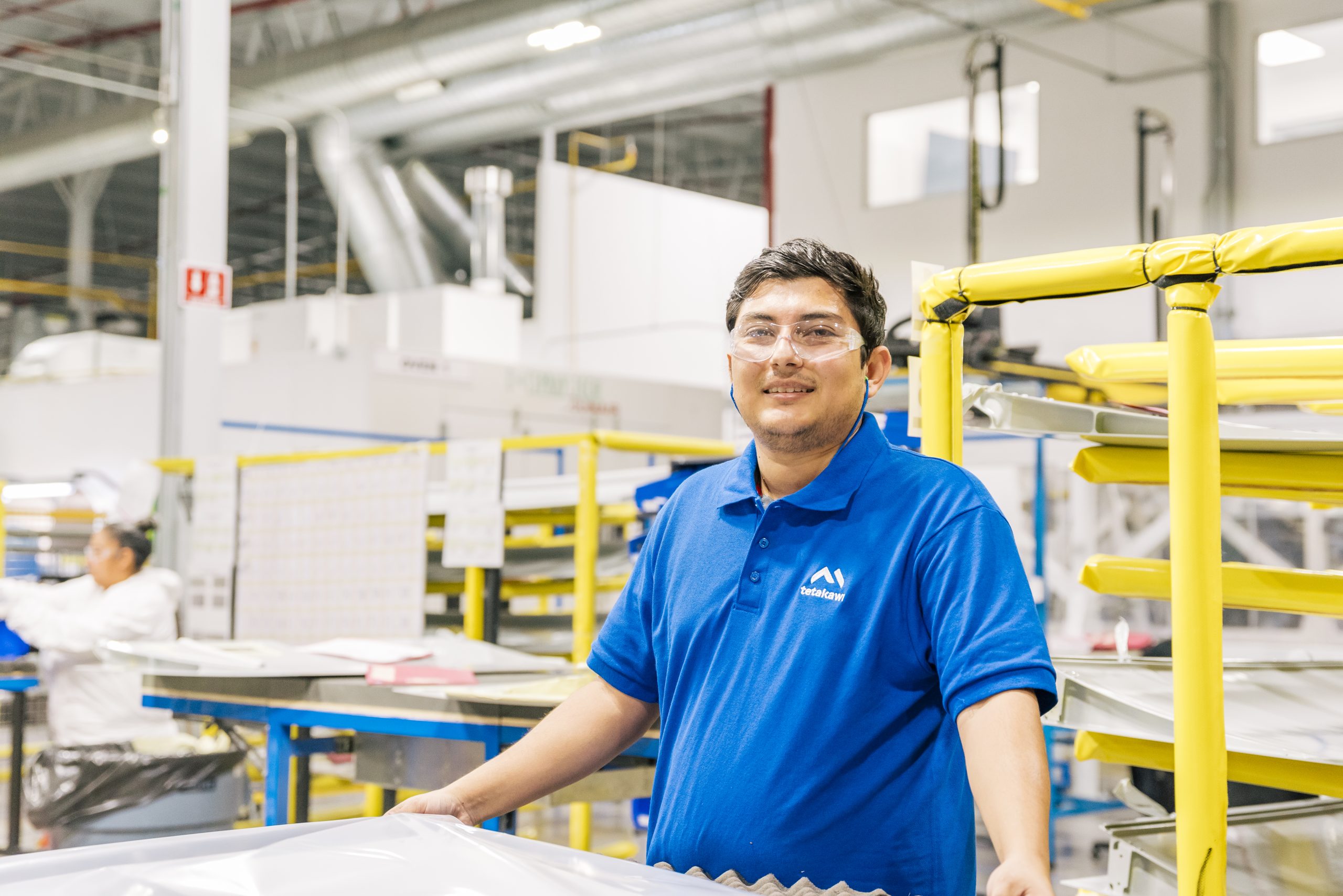 Manufacturing operator employed by a Tetakawi client inside a production facility in Mexico