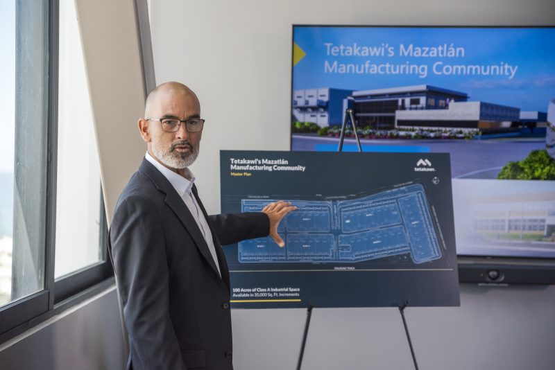 Tetakawi executive presenting the master plan of the Mazatlán Manufacturing Community with site layout display