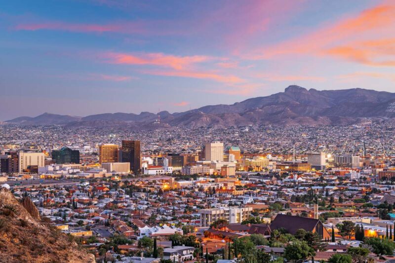 El Paso, Texas and Ciudad Juarez, Mexico border corridor skyline at dusk