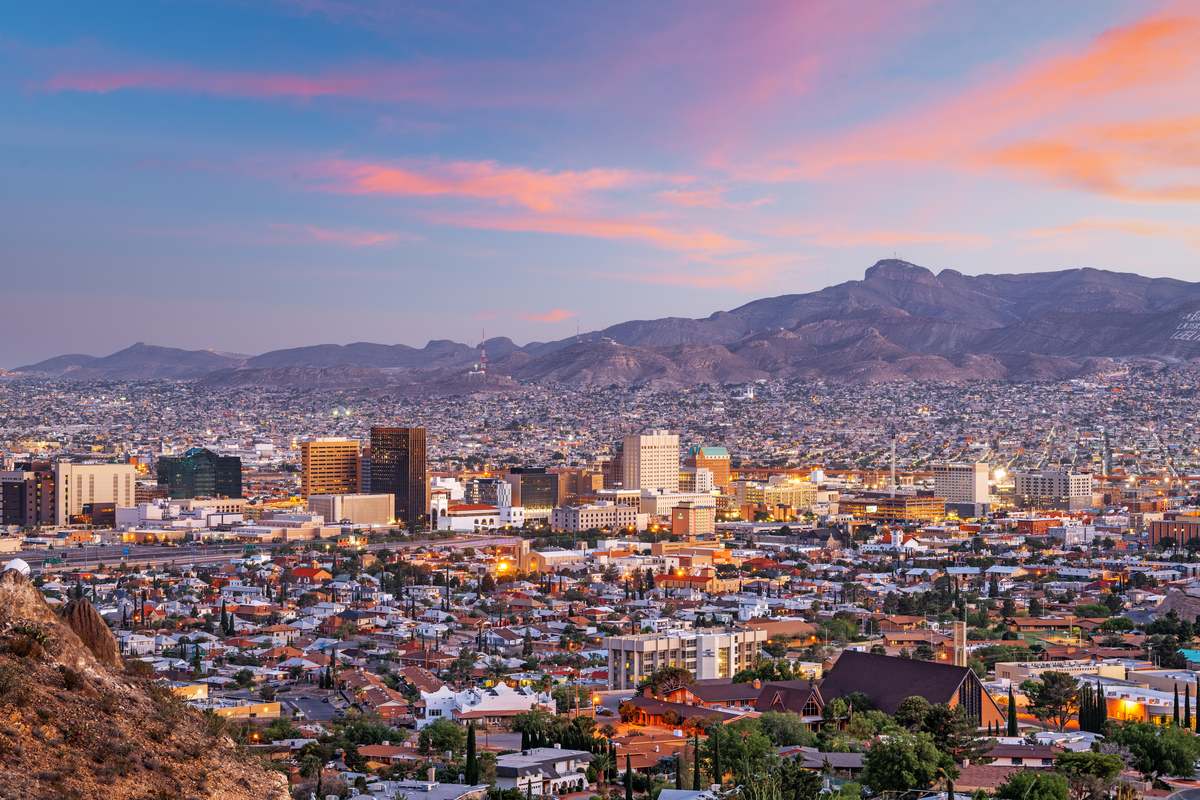 El Paso, Texas and Ciudad Juarez, Mexico border corridor skyline at dusk